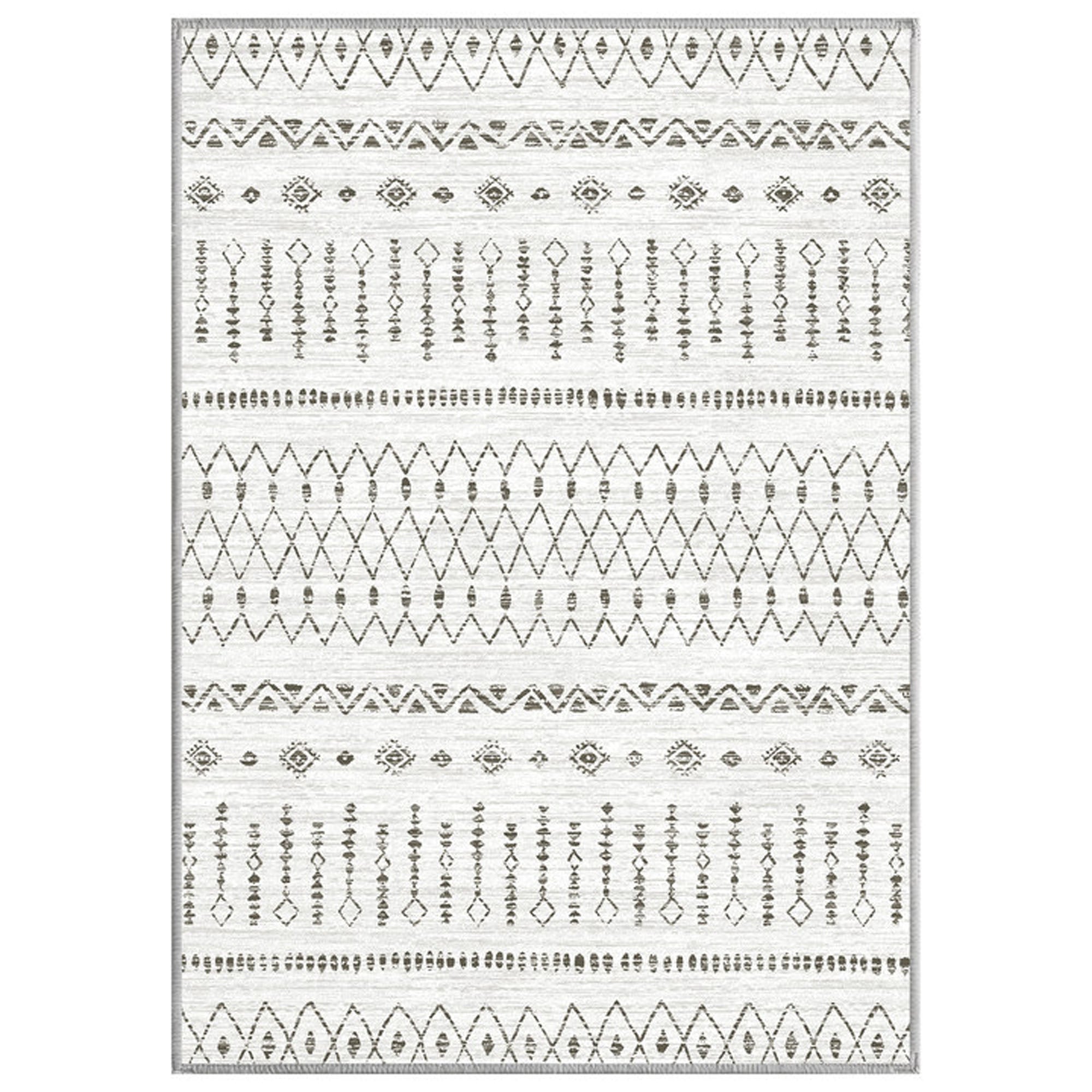 Rectangular Starry Sand Faux Wool Rug with a light textured background and dark geometric patterns, zigzags, and diamonds. Washable rug.