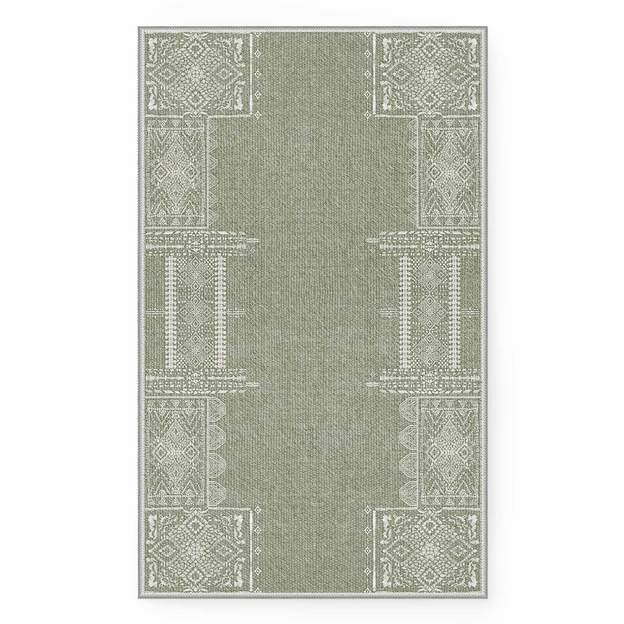 Green faux wool area rug with intricate white geometric patterns, "The Dream of Mobius" design. Washable, soft home decor rug.