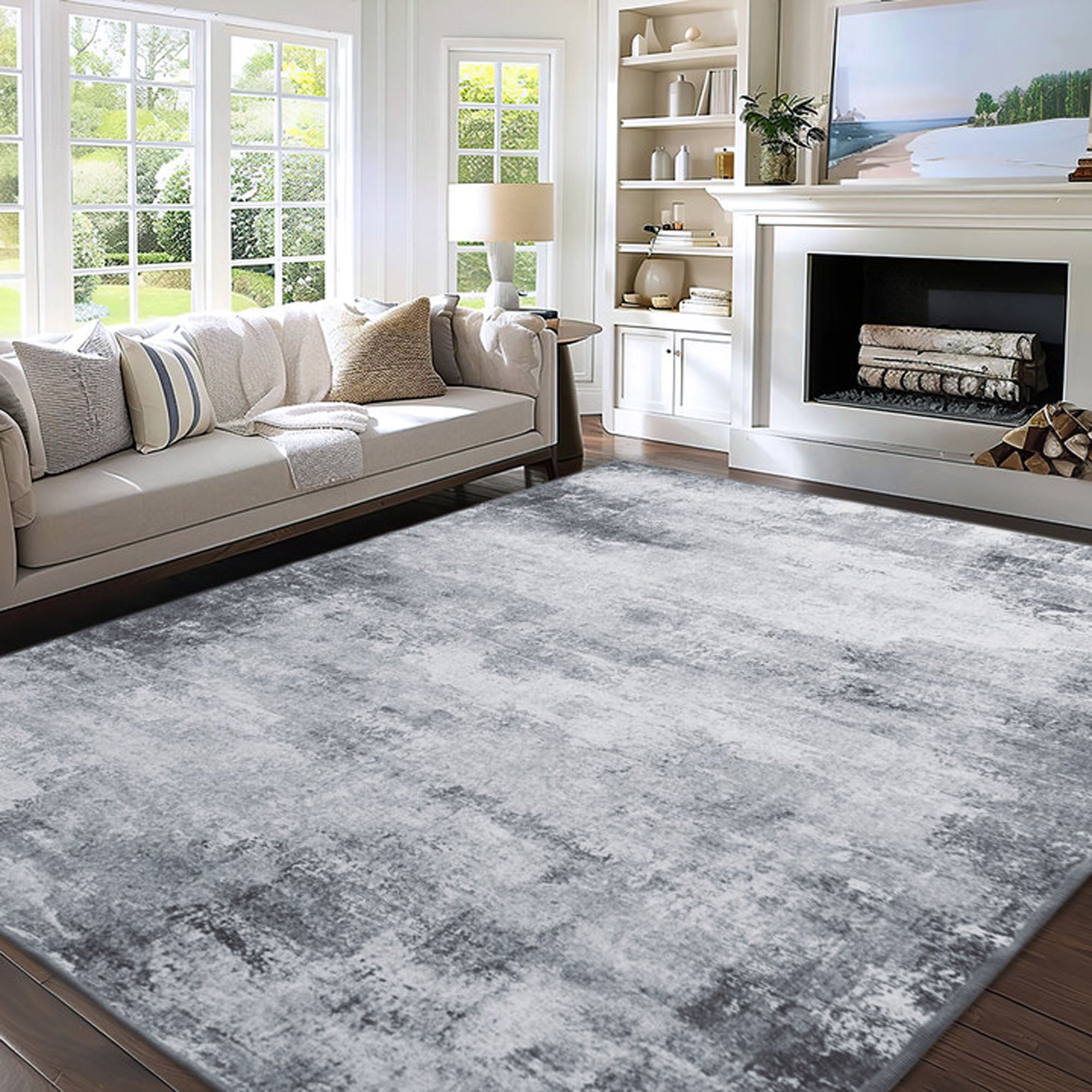 Dream Maze faux wool rug with a grey and white abstract pattern covering a modern living room floor with a sofa and fireplace.