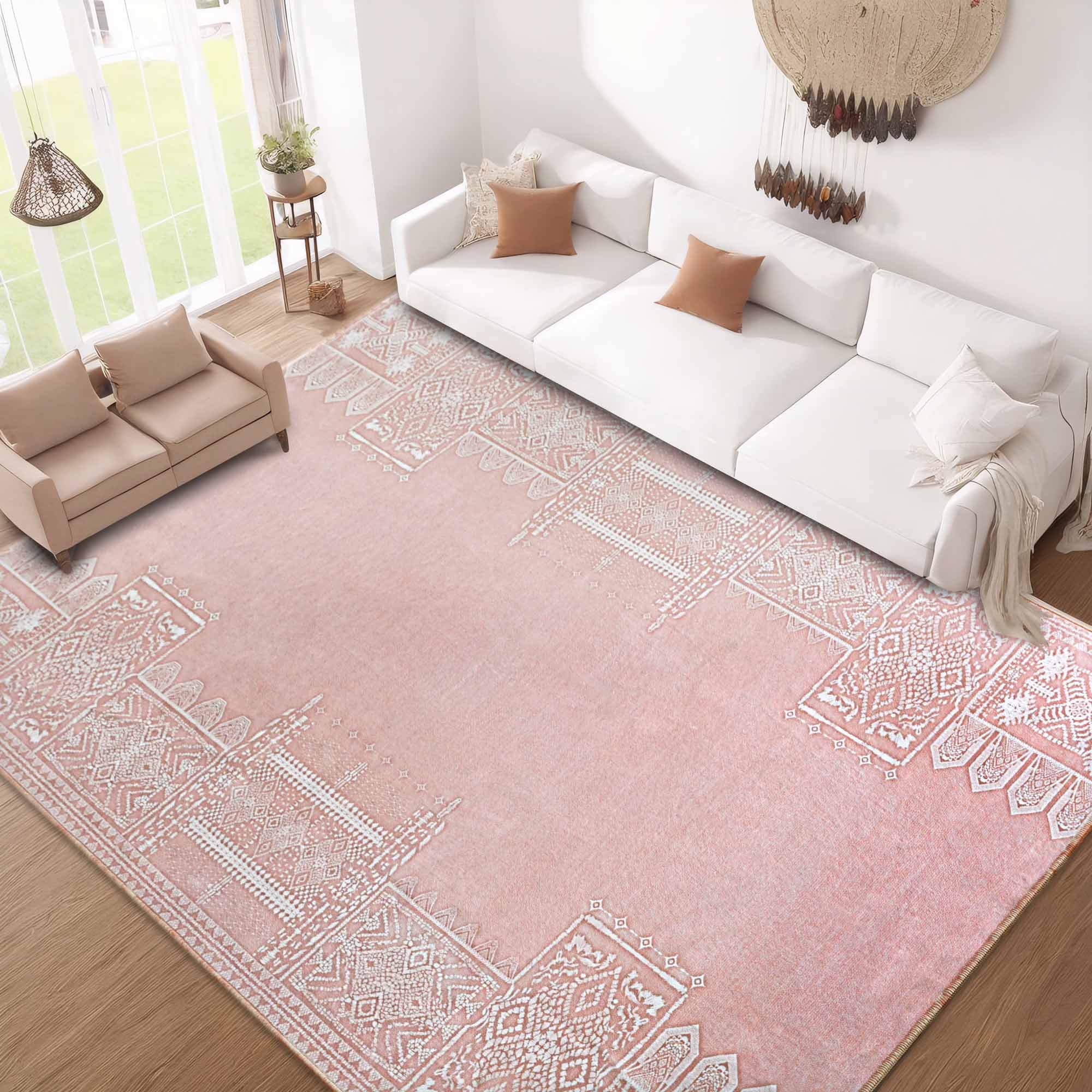 Large pink faux wool rug featuring intricate white tribal patterns, elegantly decorating a bright living room with sofas.