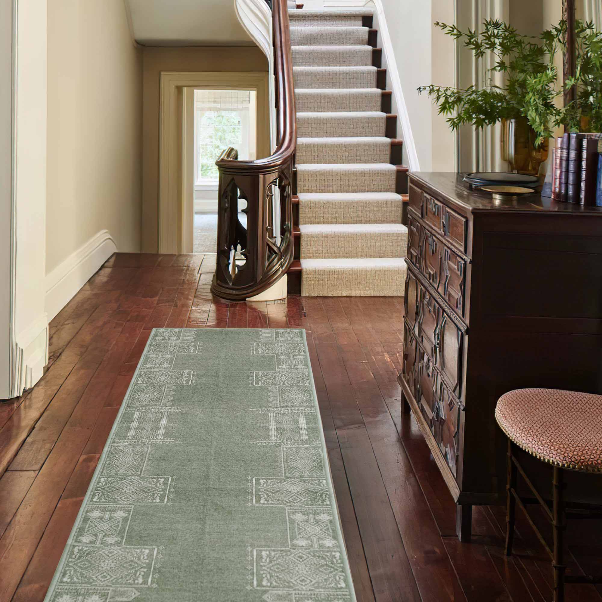 Long Dream of Mobius Faux Wool Rug in sage green with geometric white patterns, perfectly placed in a classic wood hallway.