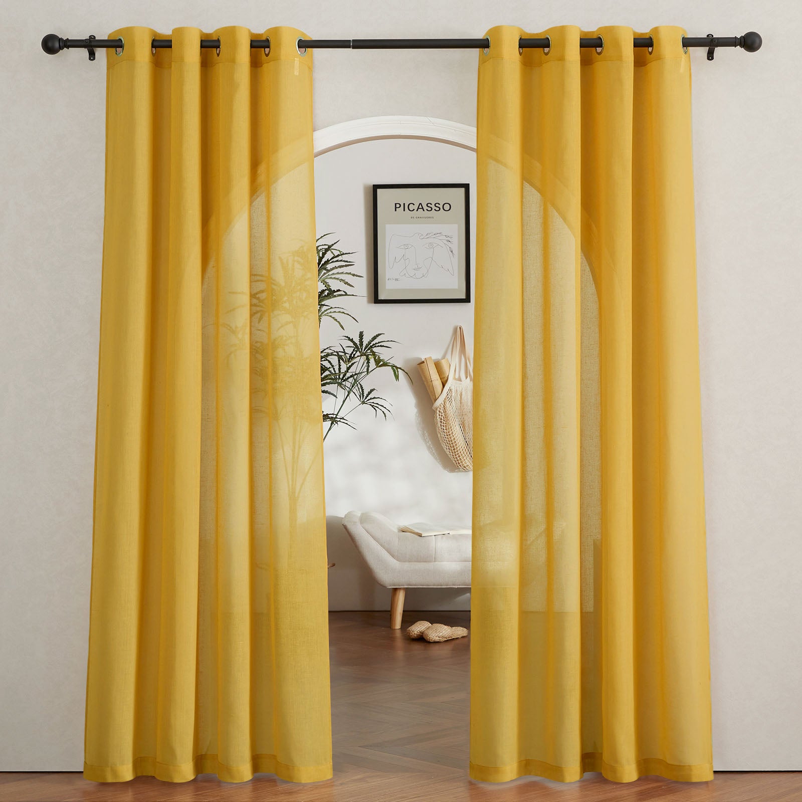 Yellow faux linen sheer curtains hung on a black rod, parted to show their light-filtering texture in a modern entryway.