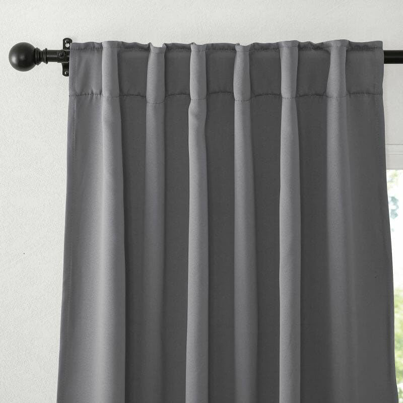 Close-up of a grey flame retardant curtain, showcasing the rod pocket top and soft fabric texture.
