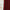 Close-up of deep red flame retardant curtains with visible folds and rich fabric texture, next to a white wall.