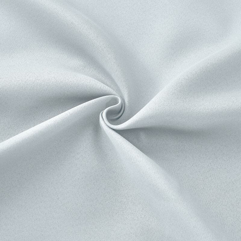Swirled light gray flame retardant curtain fabric, highlighting its subtle texture and soft, durable weave.