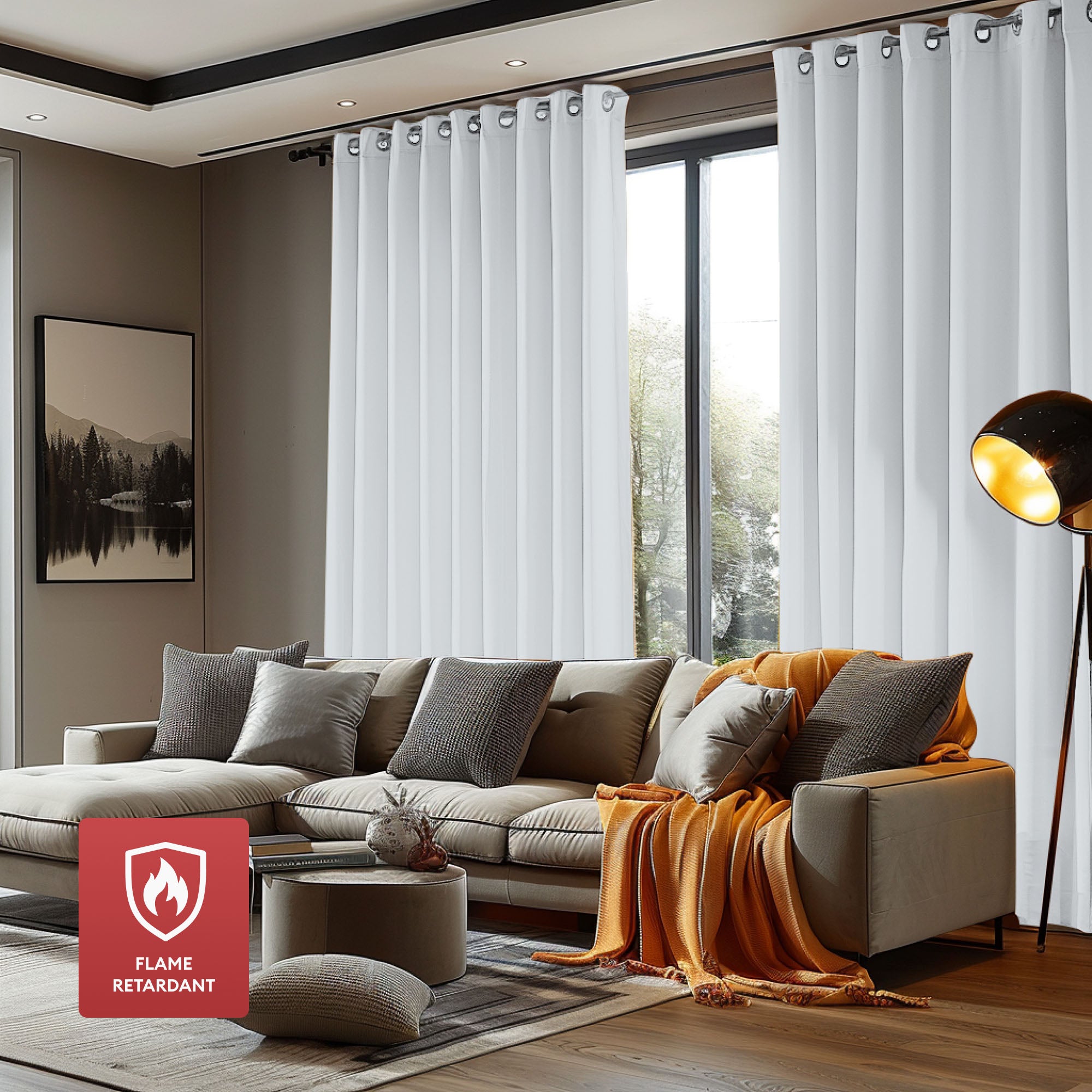 Grommet white flame retardant curtains covering a large living room window, complementing the modern sectional sofa and decor.