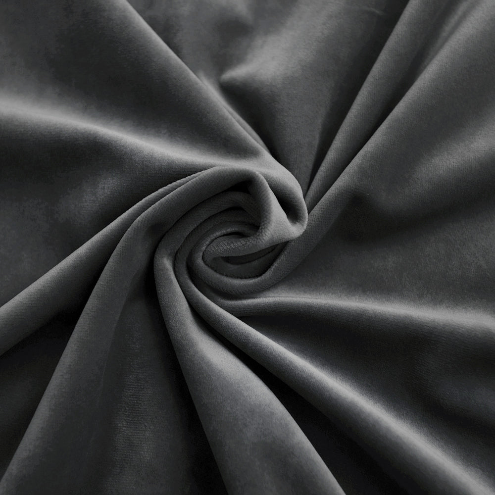 Close-up of soft dark grey velvet fabric swatch, showing luxurious texture and subtle sheen with graceful folds.