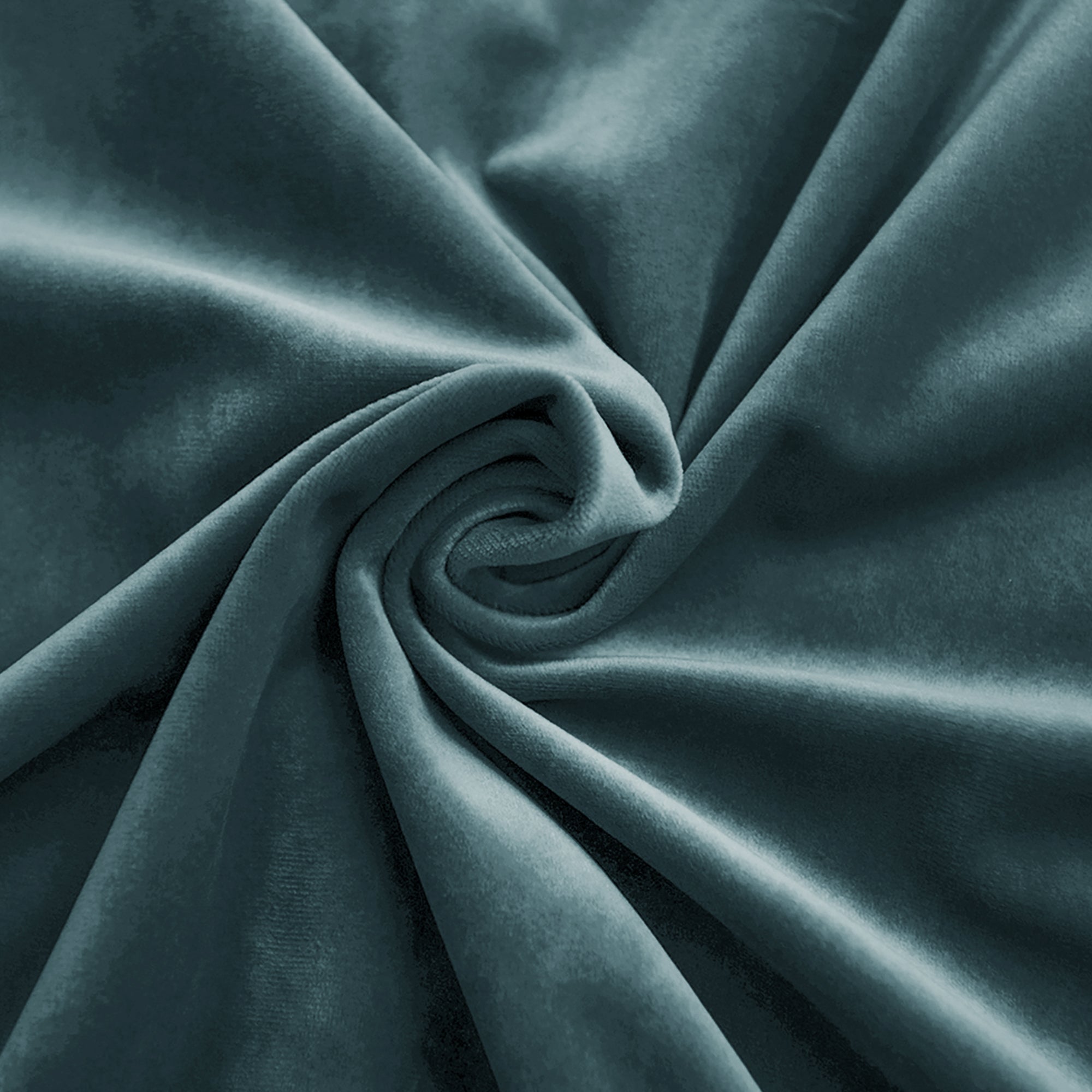 Detailed close-up of rich teal velvet fabric, luxuriously folded and swirled to showcase its soft, plush texture and elegant sheen.