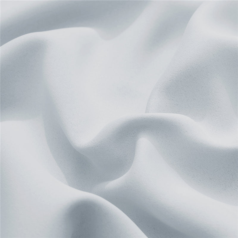 Detail of the white, textured waterproof outdoor curtain fabric, highlighting its soft weave and durable material.