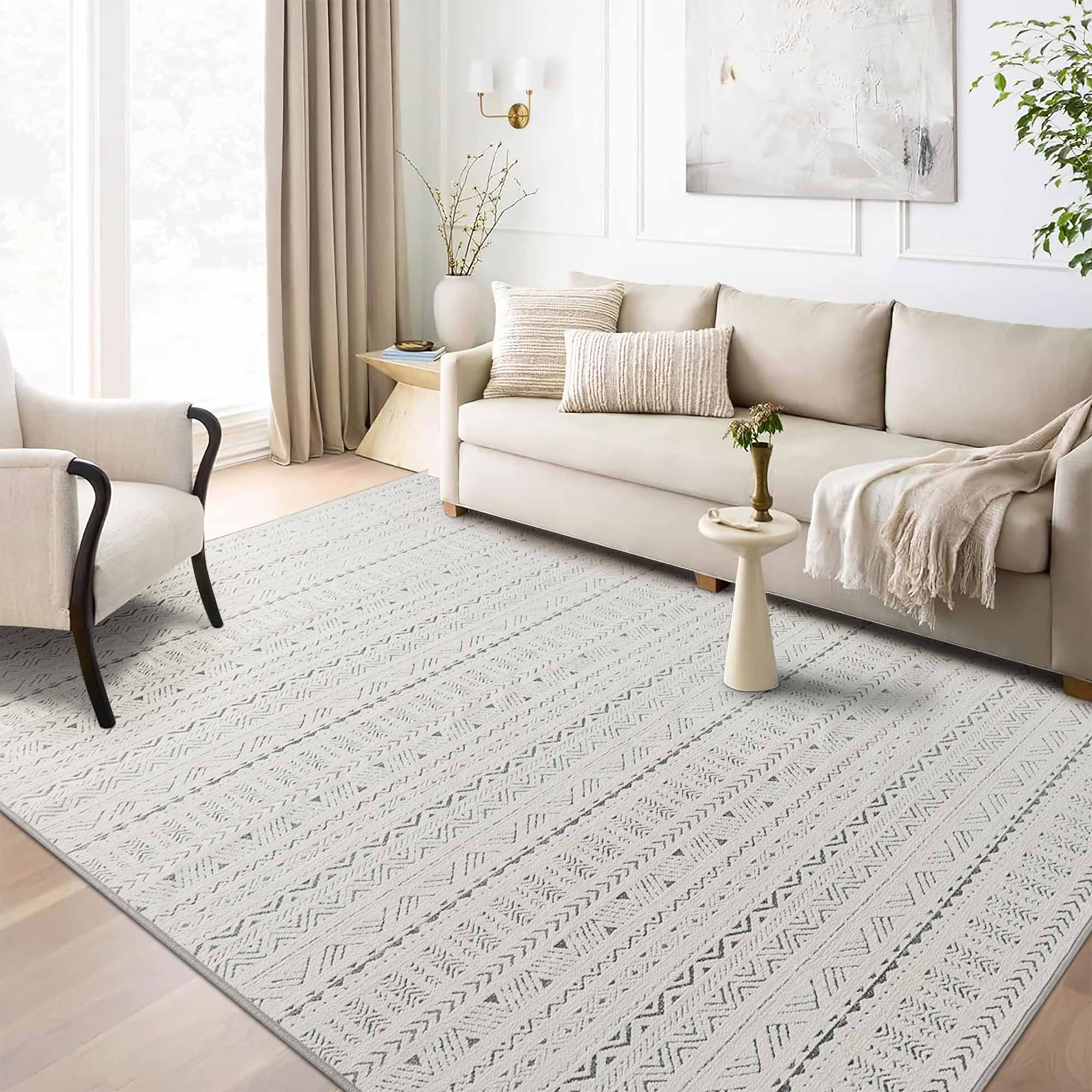 Light grey Tubekale Moroccan Jacquard Chenille area rug with geometric patterns in a modern living room setting.