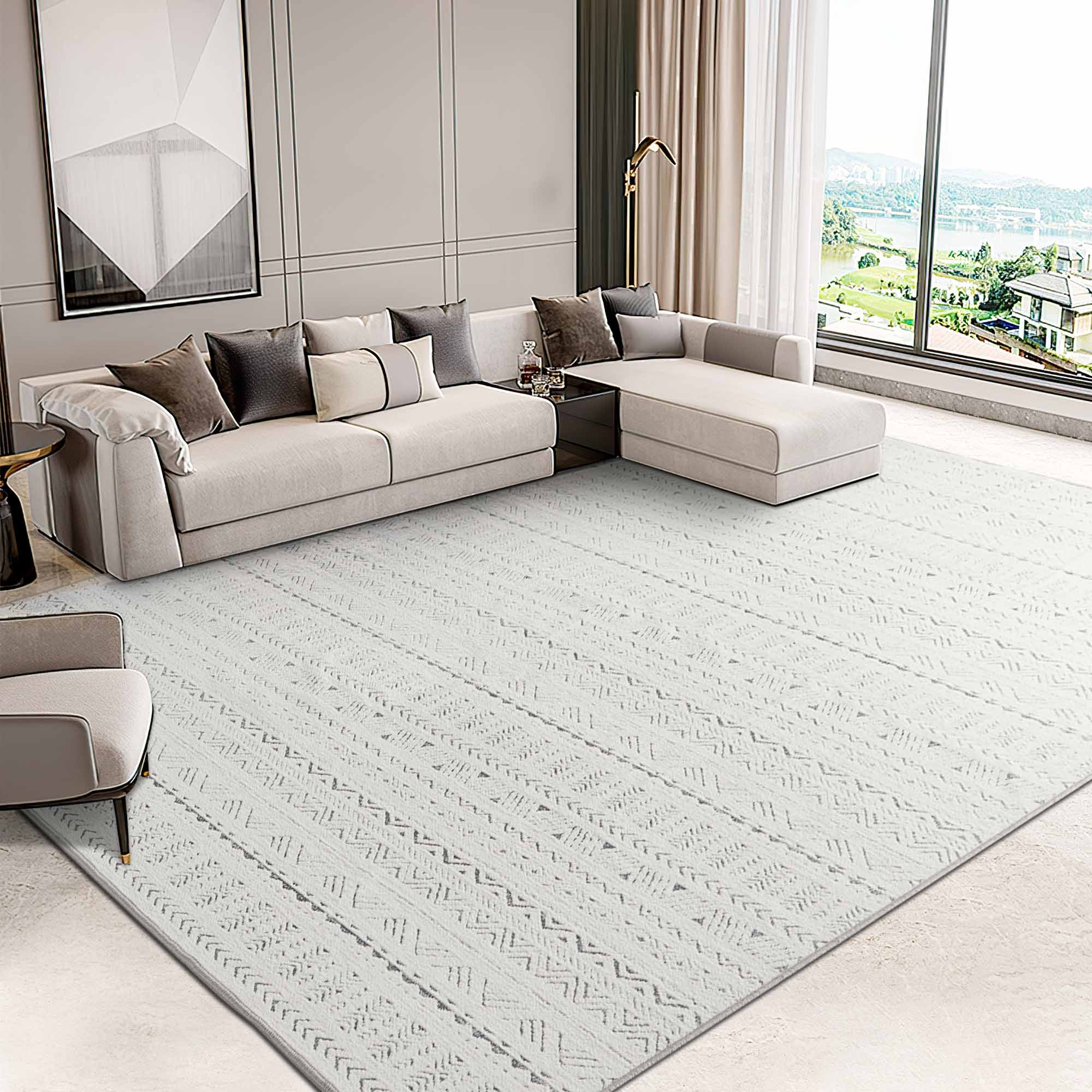 Large light grey Jacquard Chenille Tubekale Moroccan area rug with geometric patterns in a modern living room with a sectional sofa.