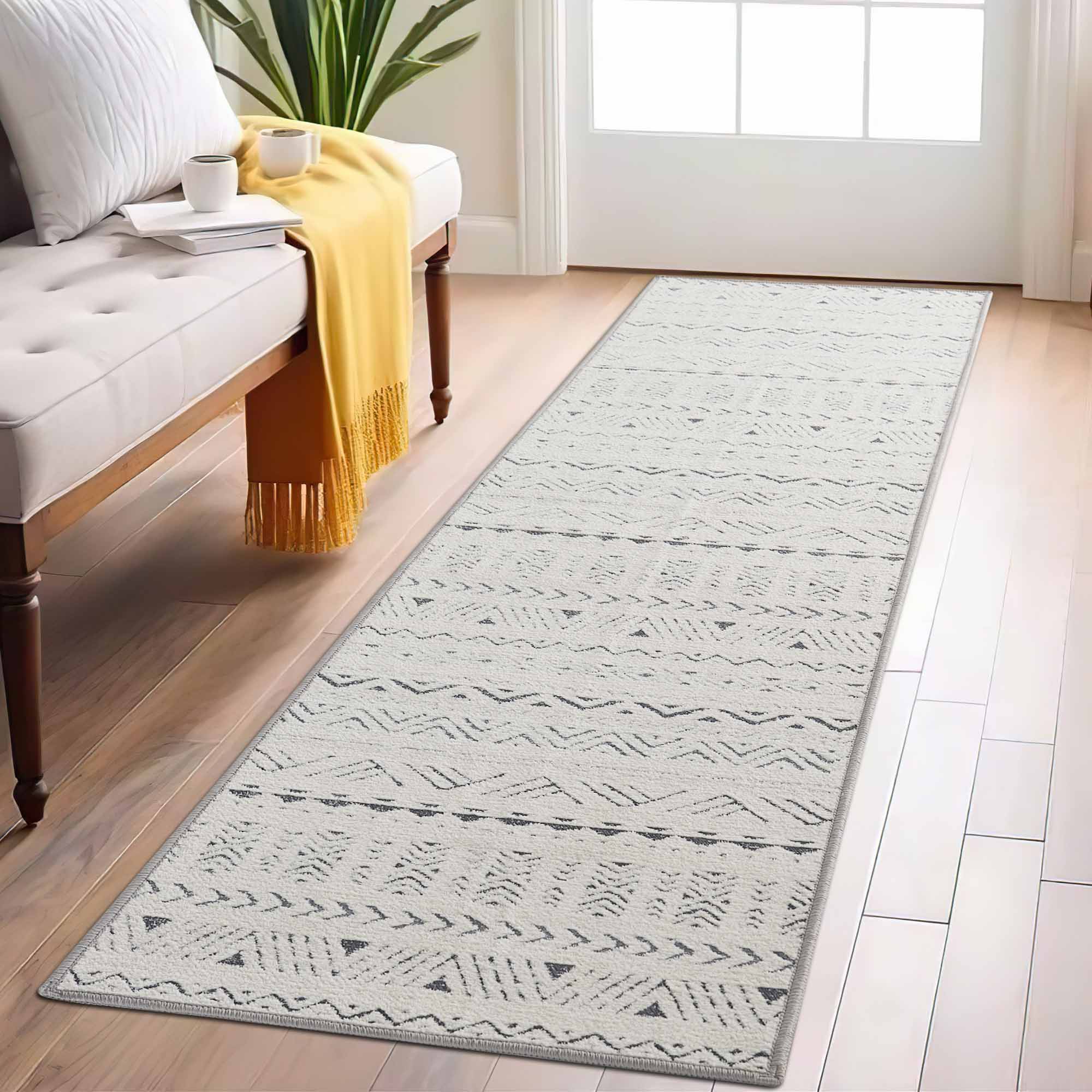 Full view of a Tubekale Moroccan Jacquard Chenille runner rug with geometric patterns on a hardwood floor in a bright entryway.