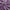 Close-up of soft purple velvet fabric swirled, showcasing its luxurious texture and subtle sheen from folds.