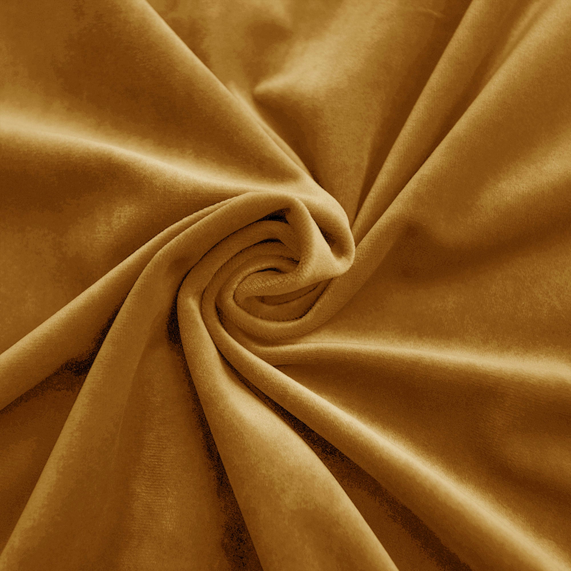 Golden-brown velvet fabric swatch folded into a spiral, highlighting its soft, luxurious texture and rich sheen.