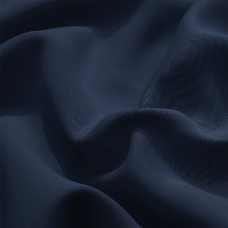 Close-up of the textured navy blue waterproof fabric for custom outdoor curtains, highlighting the material and soft folds.