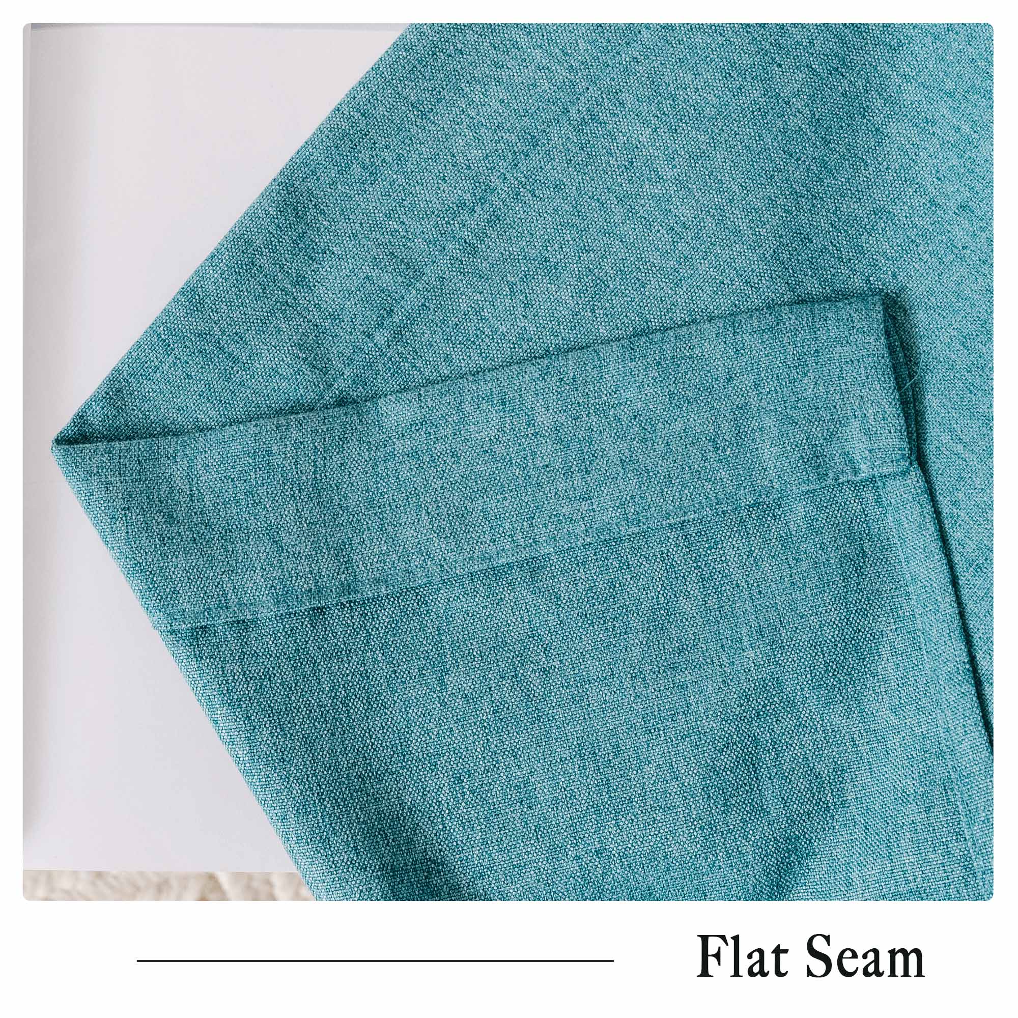 Close-up of a teal soft cotton linen curtain, highlighting the fine fabric texture and a neat flat seam.