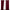 Pair of burgundy sound barrier 100% blackout curtains with grommets, partially open on a window showing trees outside.