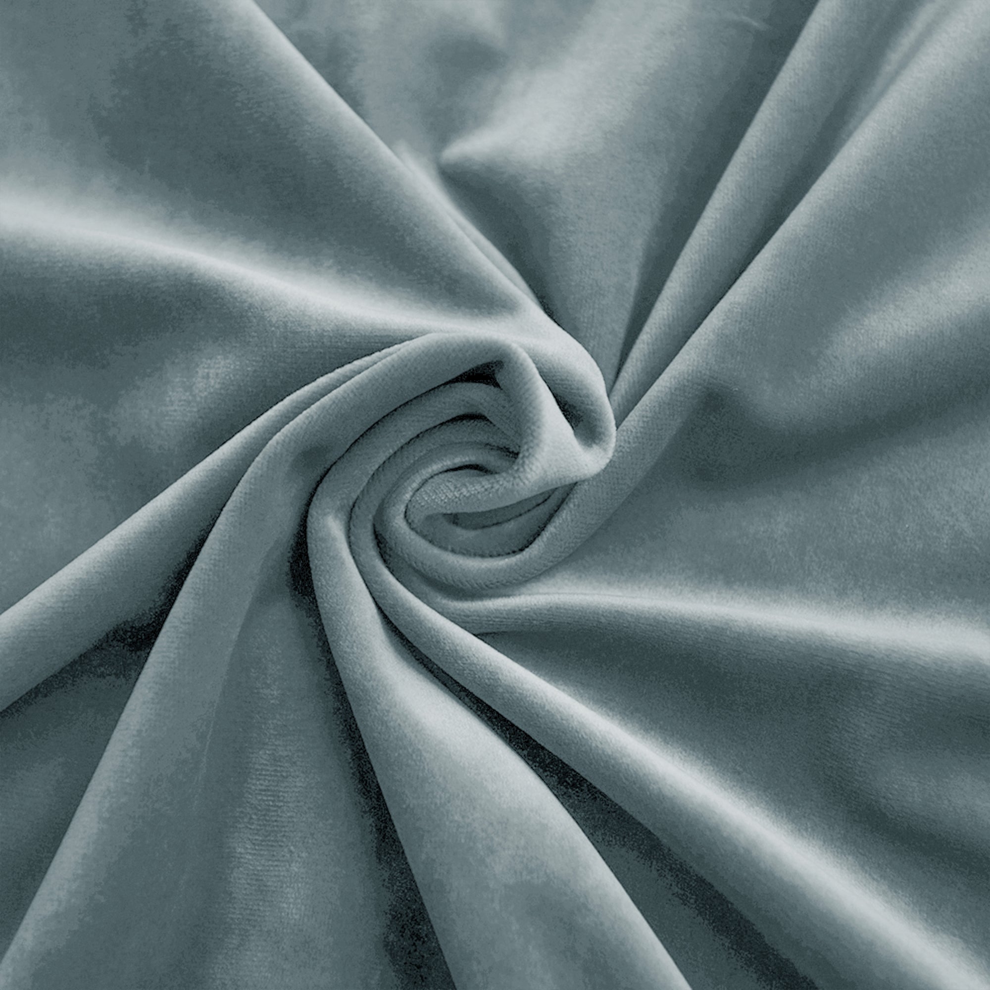 Close-up of a blue-grey velvet fabric swatch, showing its plush, soft texture and luxurious sheen in elegant folds.