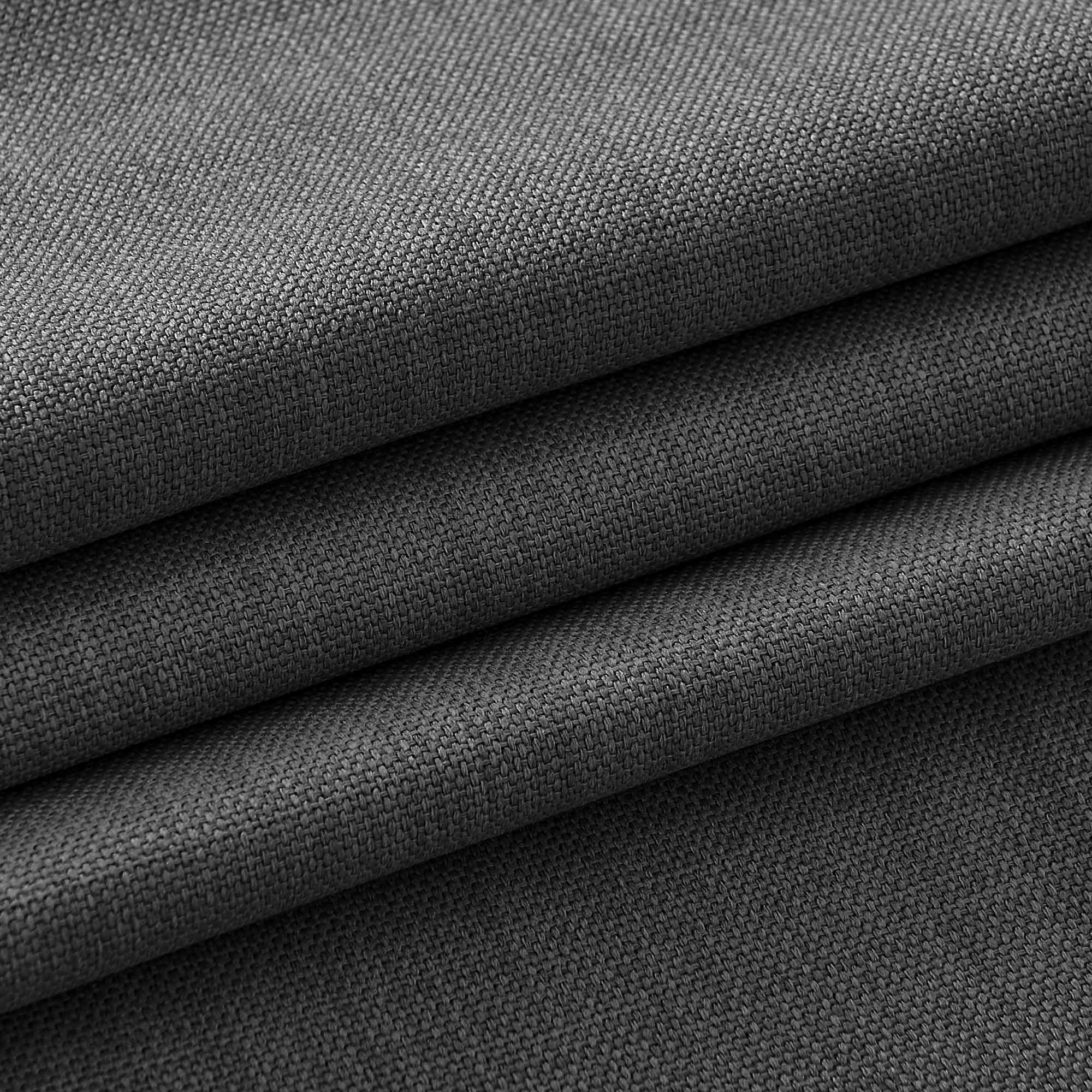 Close-up of a dark grey tablecloth fabric, highlighting its durable woven texture and multiple folds.