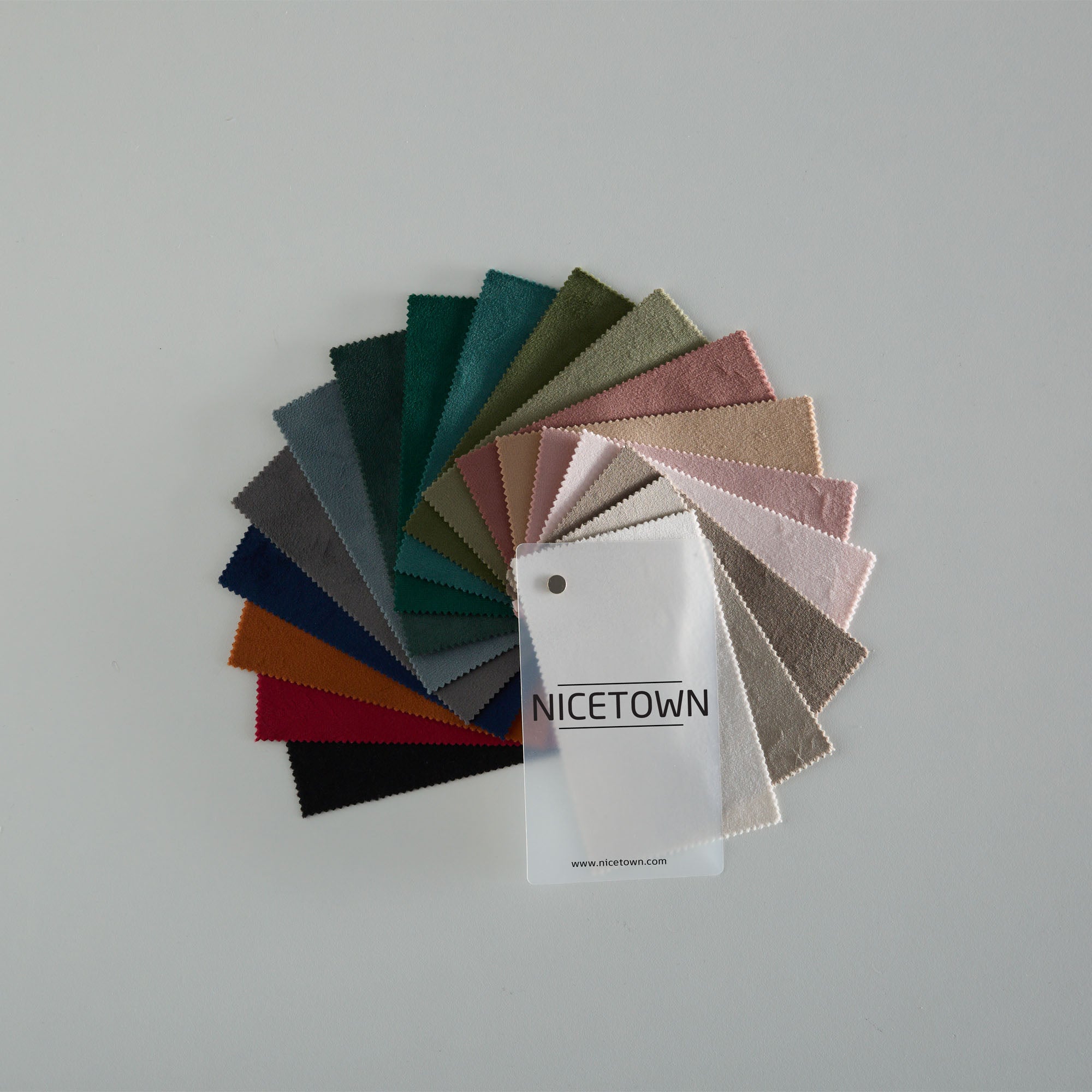NICETOWN velvet fabric swatches fanned to reveal many colors & textures for custom curtains & home decor.