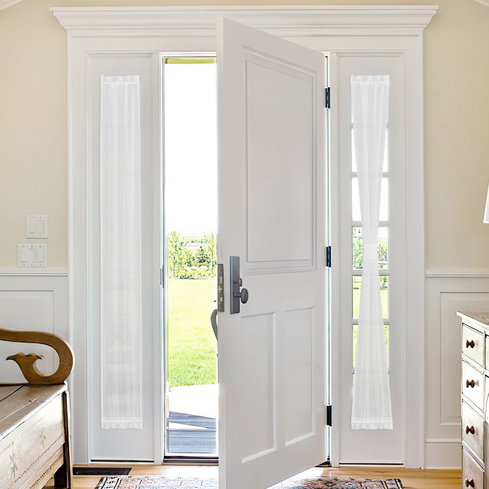 White voile sheer door curtains on a glass french door, filtering bright sunlight and adding elegant home decor.