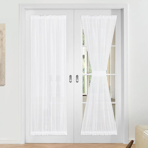 White ruffled voile sheer door curtains on French doors, one panel elegantly tied back, for privacy and light.