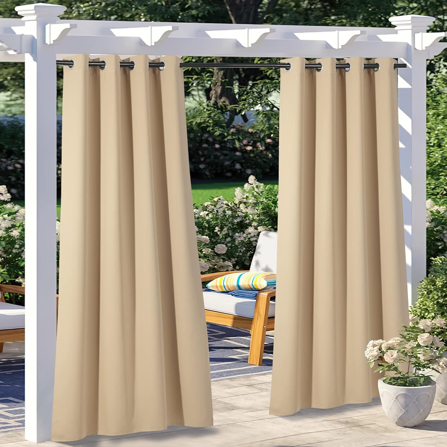 Beige NICETOWN waterproof outdoor patio curtains on a white pergola. Thermal insulating, blocking sunlight for privacy and furniture protection.