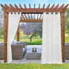 White waterproof sheer outdoor curtains hanging on a wooden pergola, providing light filtering for a patio with seating and fire pit.