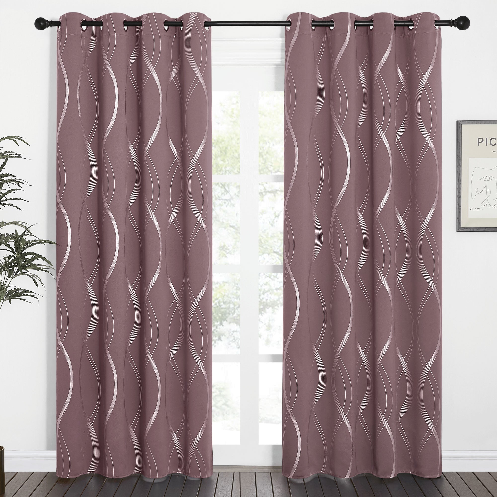 Plum Wave Line Blackout Curtains with silver wavy pattern and grommet top, hanging on a black rod in a room with a window.