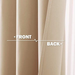 Close-up of beige curtain, showing smooth front fabric and woven blackout lining on the back.