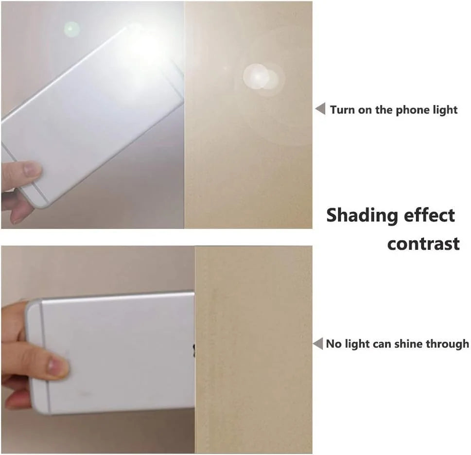 Phone flashlight testing beige blackout curtain fabric with no light passing through