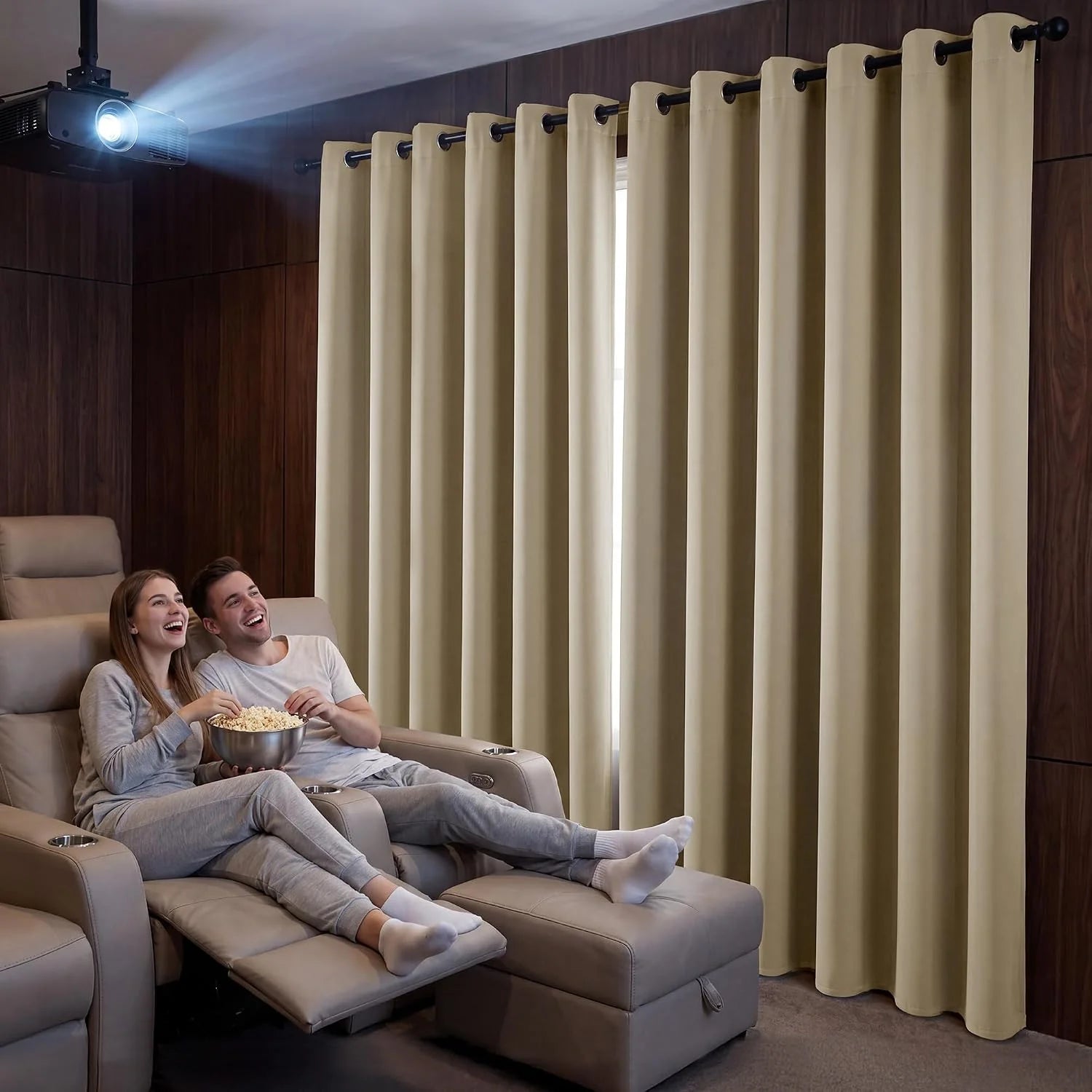 Beige blackout curtains in home theater with couple watching movie