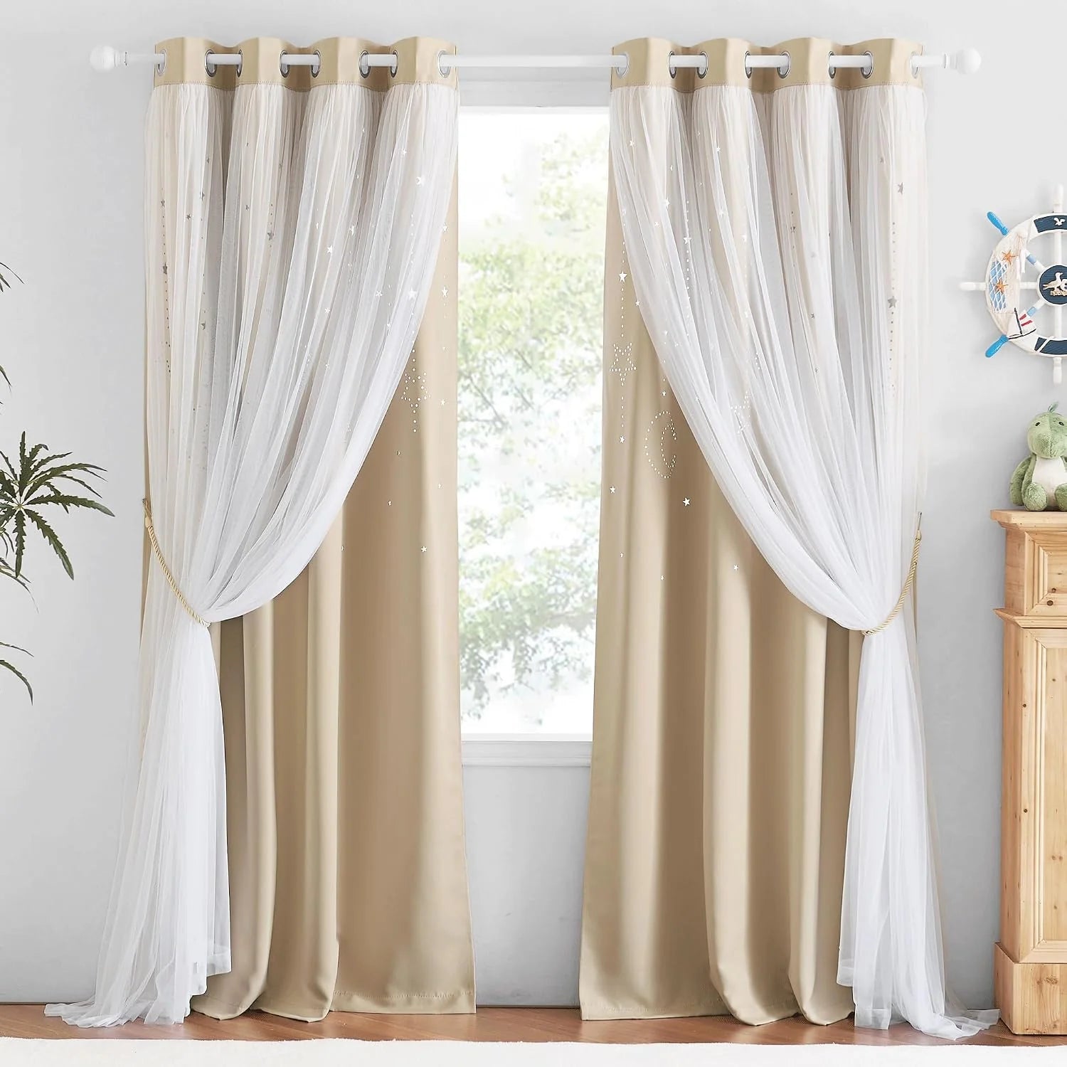Beige blackout curtains with white sheer overlay and star details on grommet rod