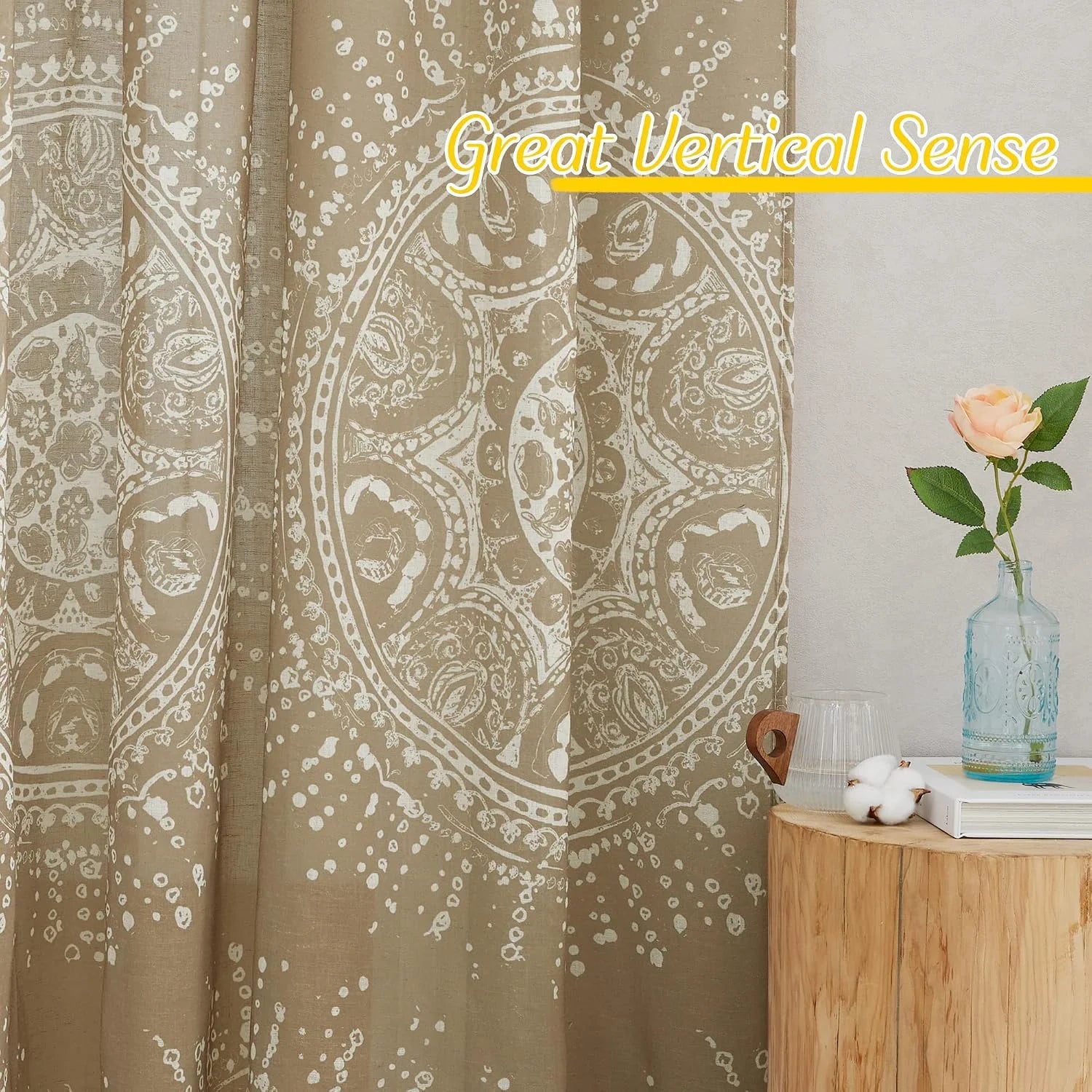 Beige patterned curtain with boho medallion print beside a wooden side table