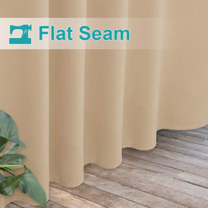 Beige curtain showcasing flat seam. Features scalloped hem with dotted stitching near a wooden floor.