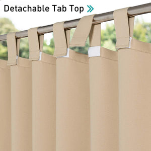 Beige curtains with detachable tab top hanging on a silver rod, showing the velcro fasteners.