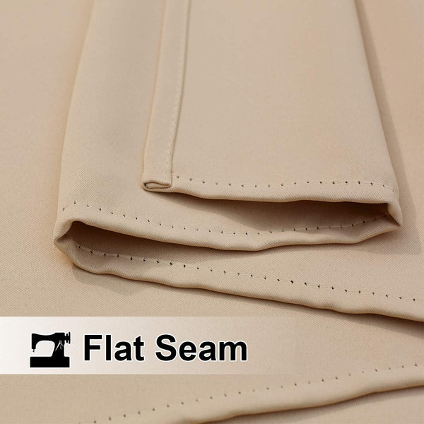 Close-up of a light beige fabric showcasing precise flat seam stitching along the hem.