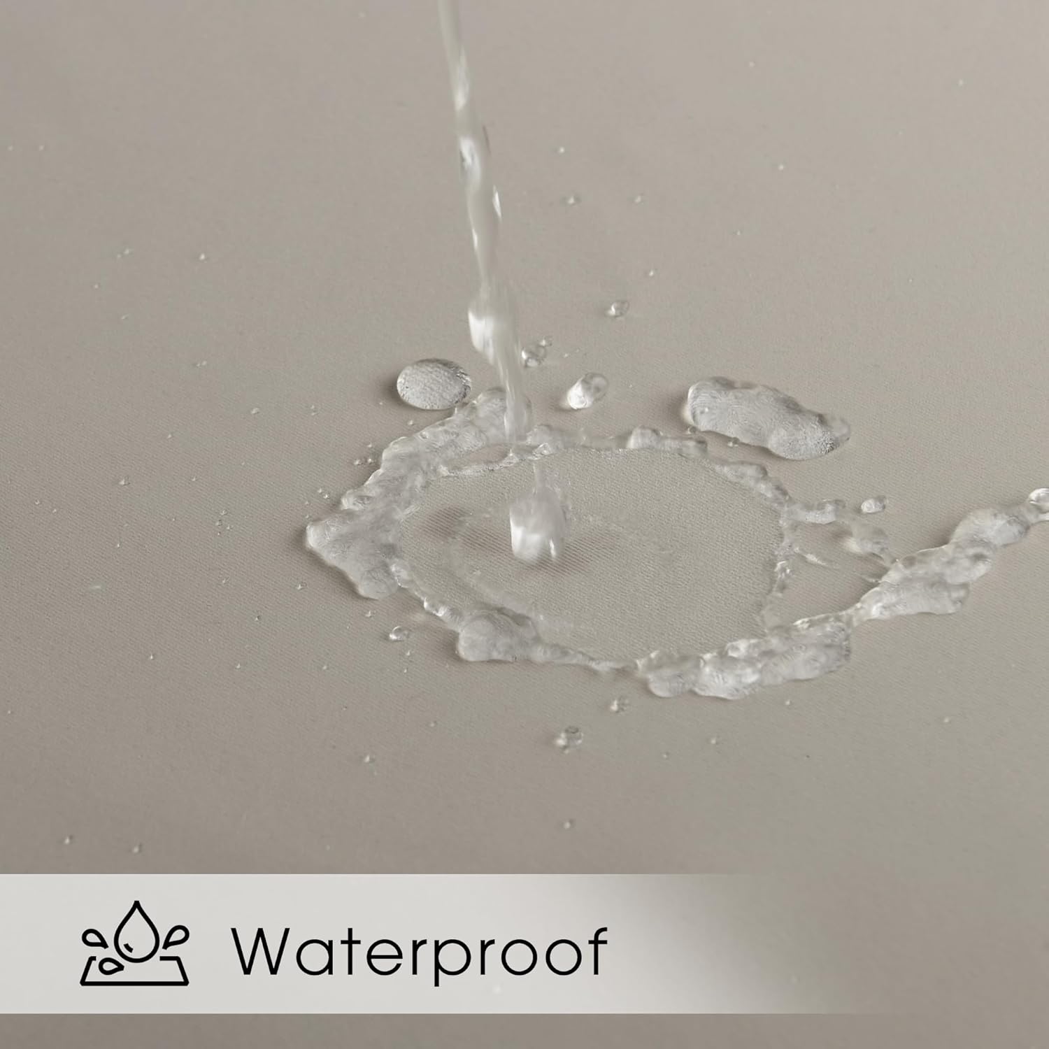 Close-up of water pouring onto a light beige waterproof fabric, showing droplets beading on the surface.