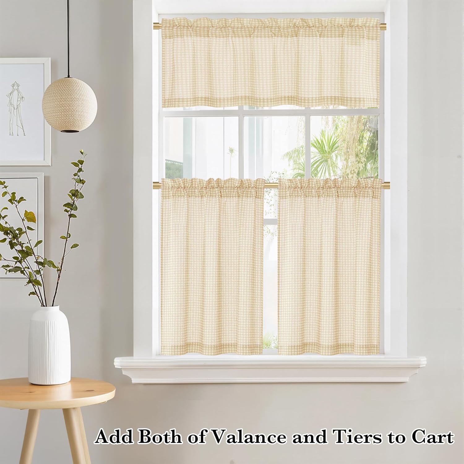 Light beige gingham check valance and tier curtains with ruffled rod pocket tops hanging on a window.