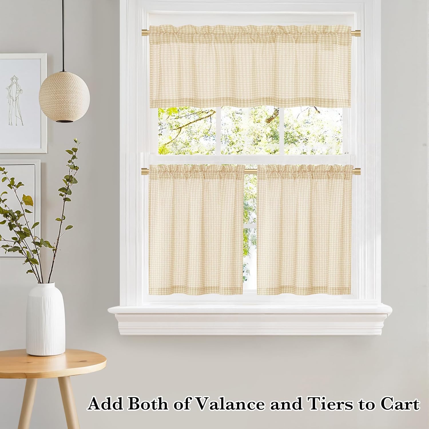 Light beige gingham check valance and tier curtains with rod pockets hanging on a white window.