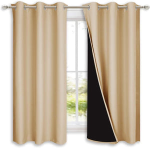 Pair of beige thermal blackout curtains with silver grommet tops. One panel shows black thermal lining.