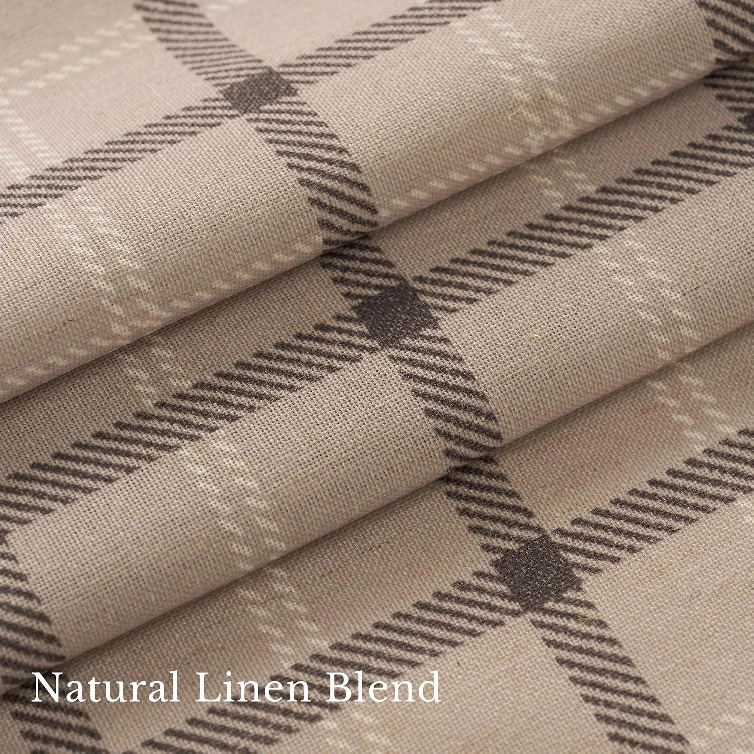 Folded beige linen blend fabric with brown plaid pattern and soft woven texture