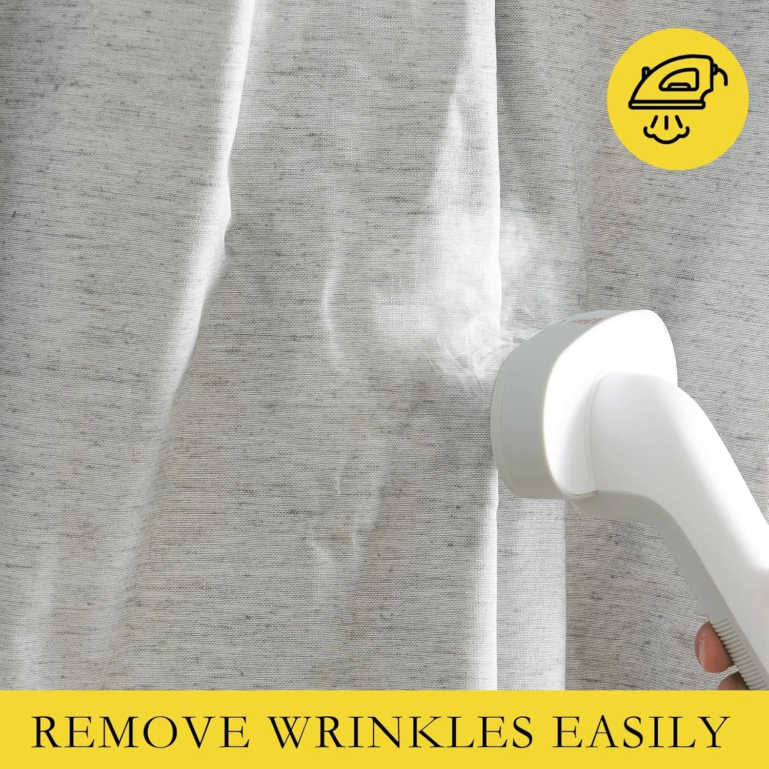 Handheld steamer removing wrinkles from a beige linen curtain panel