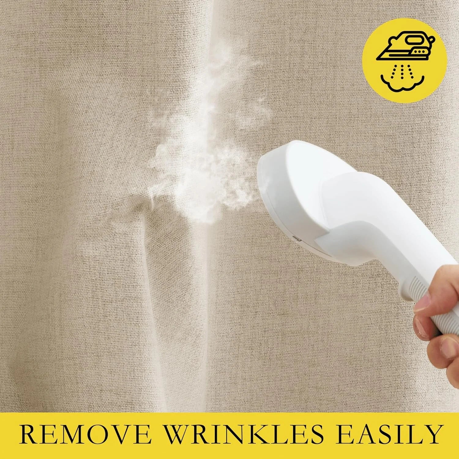 Handheld steamer removing wrinkles from a beige linen curtain fabric panel