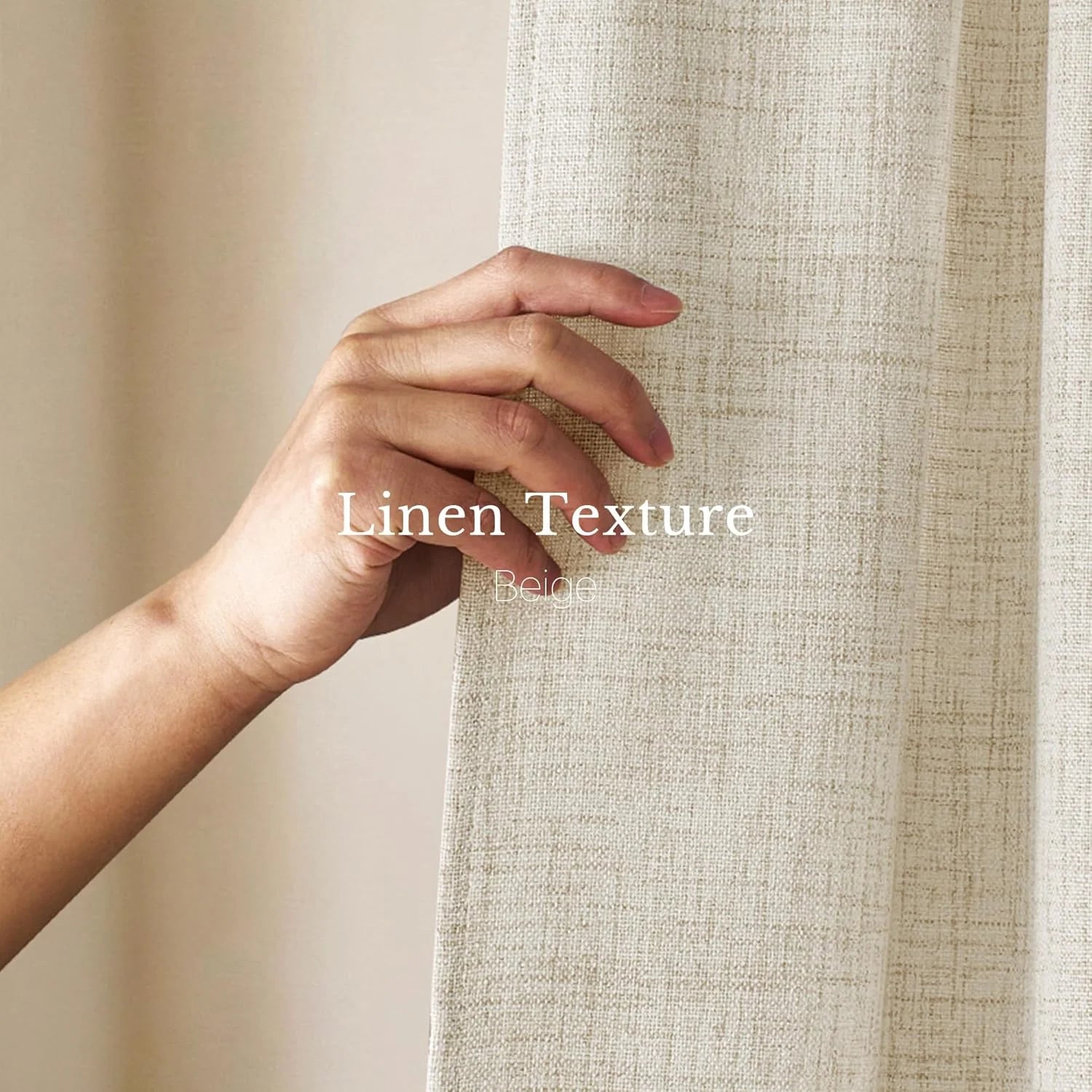 Close-up of a hand touching textured beige linen curtain fabric