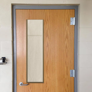 Beige linen door window privacy shade covering a vertical window on a wooden door.