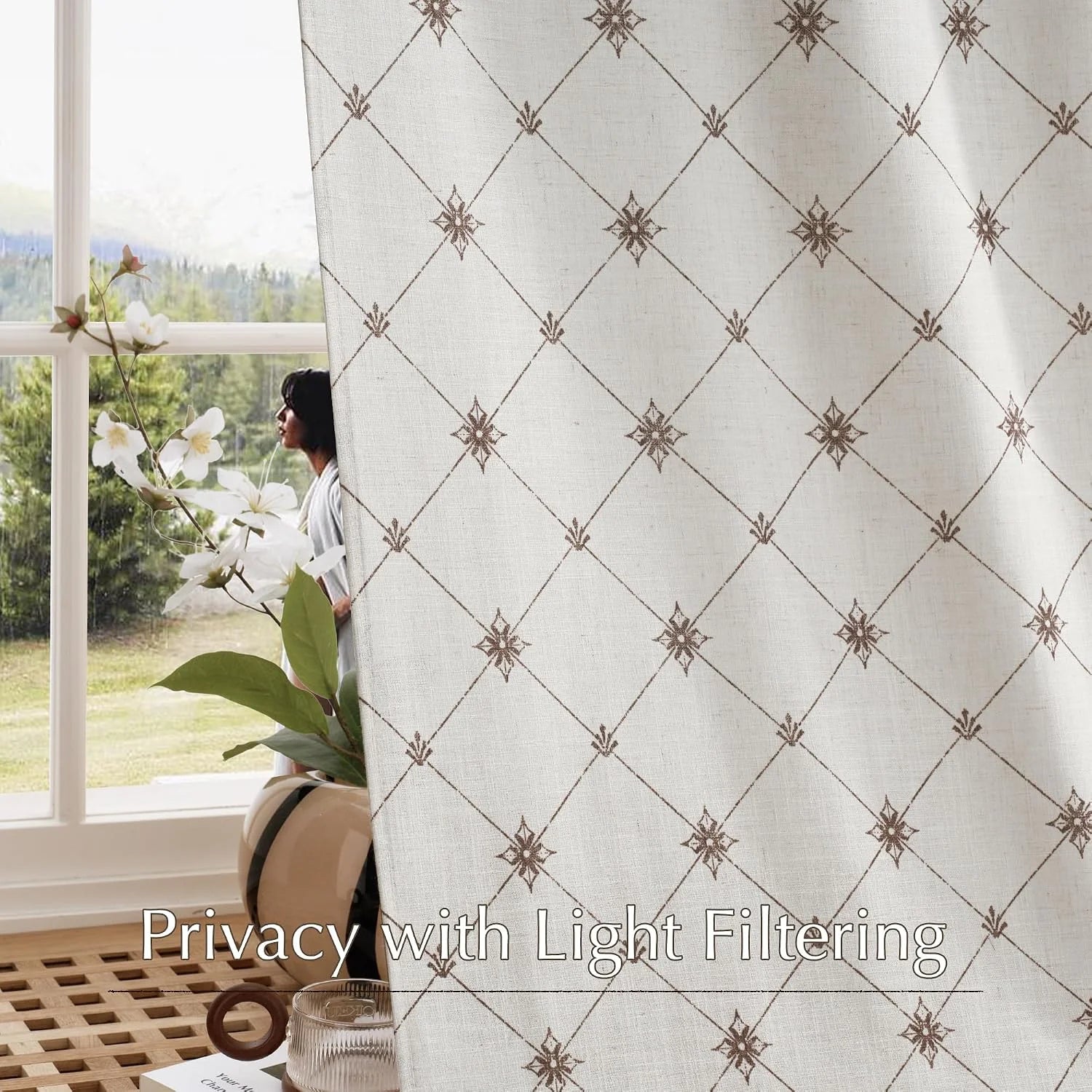 Beige linen-look light filtering curtain with brown geometric pattern by a bright window