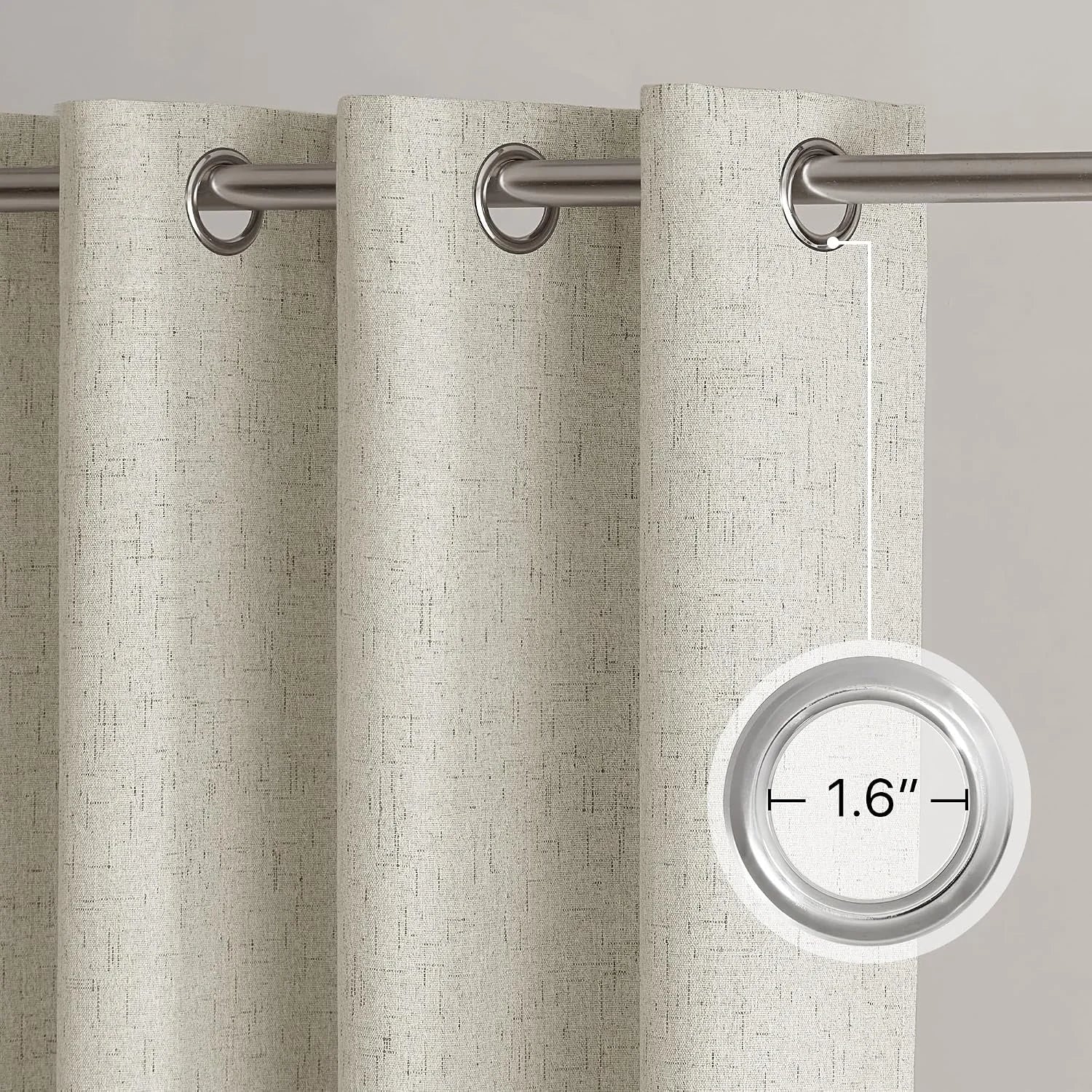Beige textured linen-look curtain panel with silver metal grommets on a rod