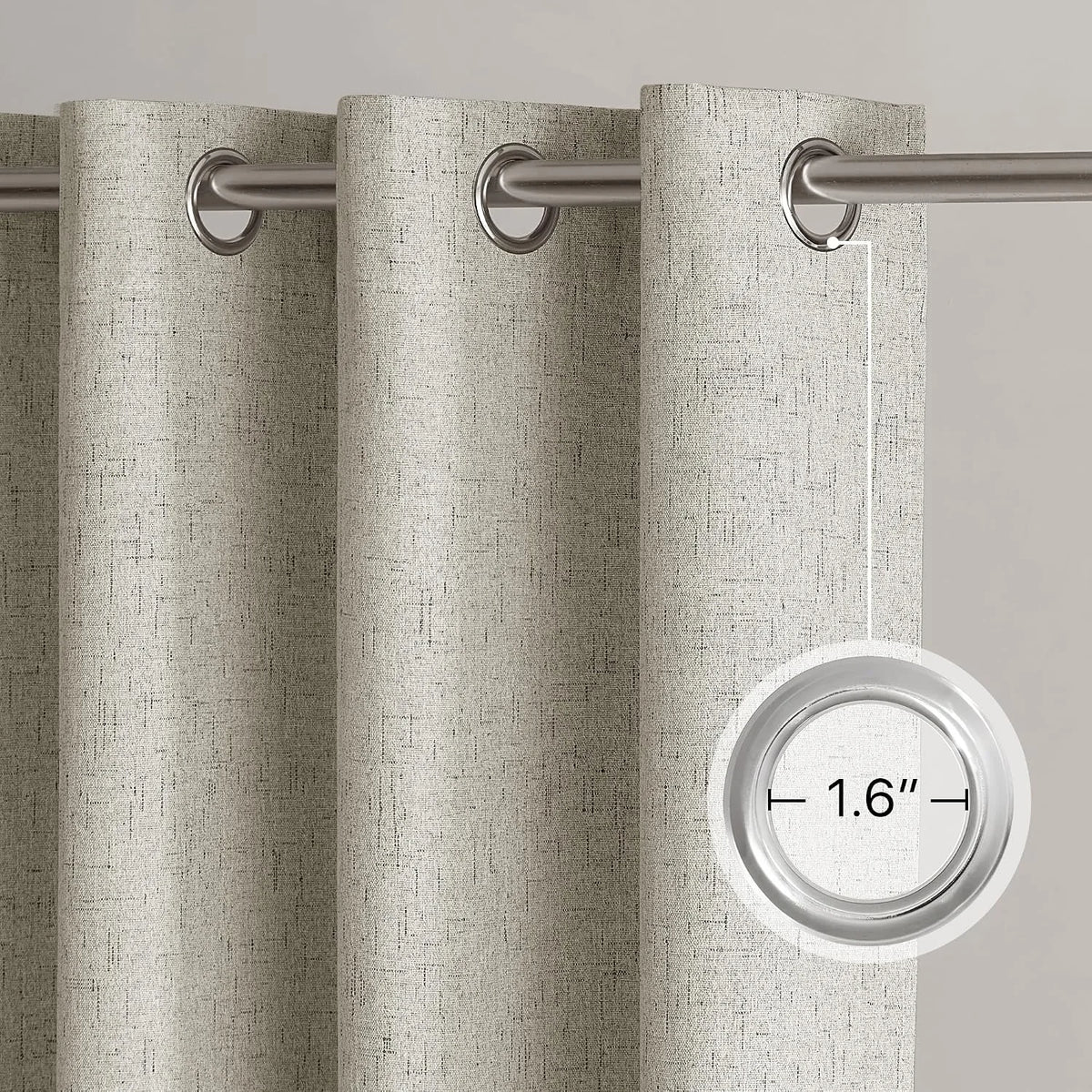 Beige textured linen-look curtain panel with silver metal grommets on a curtain rod