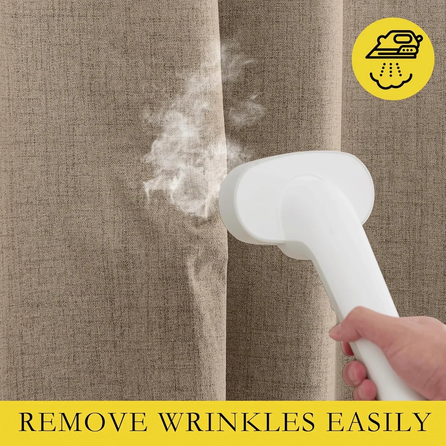 Handheld garment steamer removing wrinkles from beige linen-look curtain fabric